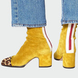 Bota s mírně vysokými podpatky a sportovními detaily